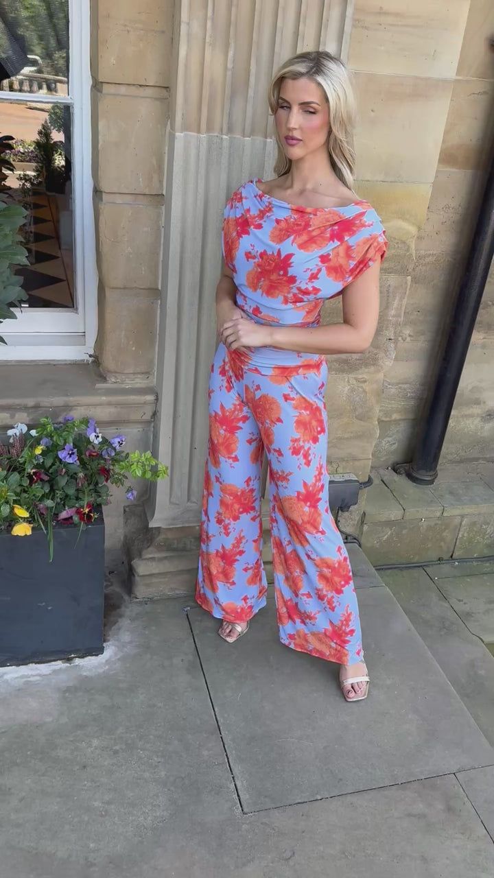 Carbon jumpsuit in powder blue & orange floral